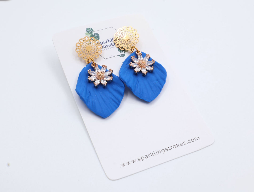 Blue Floral Dangle Earrings with Charm – Elegant & Feminine