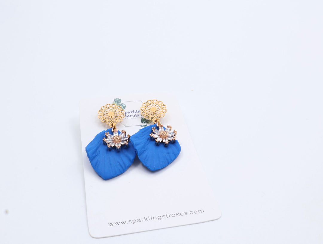 Blue Floral Dangle Earrings with Charm – Elegant & Feminine