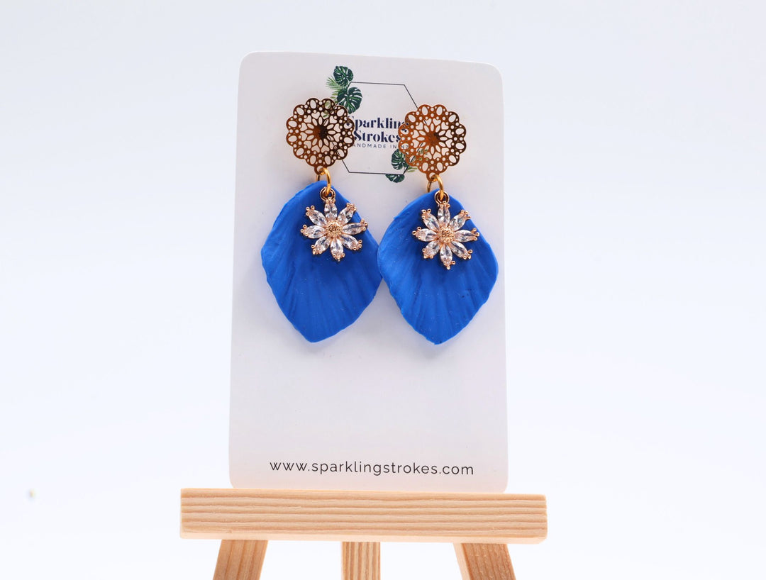 Blue Floral Dangle Earrings with Charm – Elegant & Feminine
